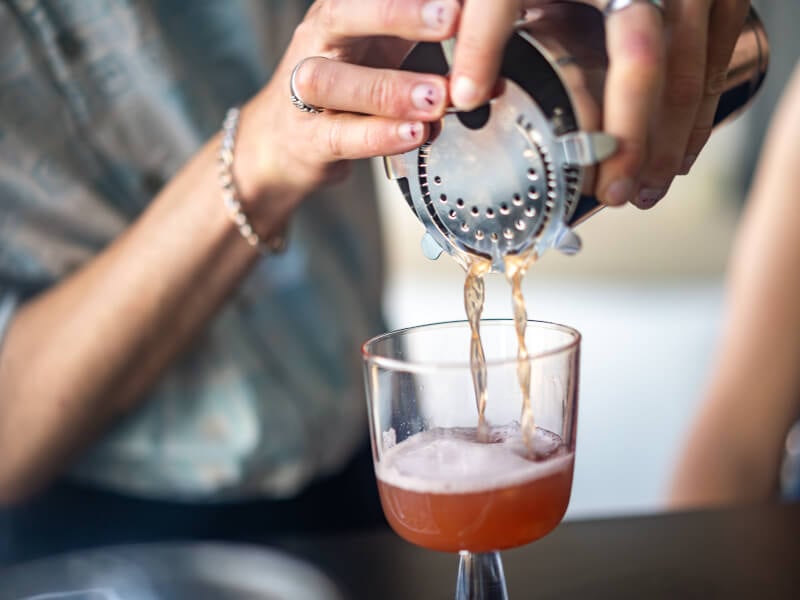 pouring cocktails at home